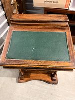 Top view showing green leather inset and wood surface