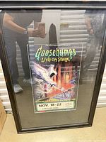 Entire framed Goosebumps poster leaning against wall