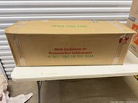 Full view of sealed shipping box showing brand and product name