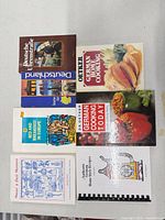 Overhead view of all eight books laid out