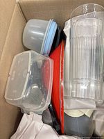 box view with tumbler, containers, sieve, red bowl