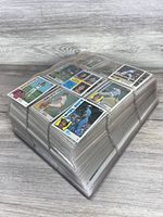 Stack of 1984 Topps cards in protective sleeves
