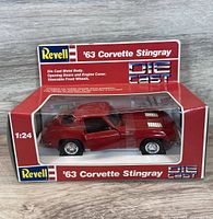 Front view showing Revell window box with red ’63 Corvette model