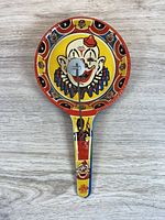 Front view showing clown design and spinner mechanism