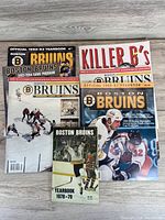 All six Boston Bruins publications laid out