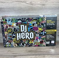 Front of original DJ Hero PS3 box