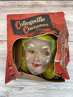 Mask inside original damaged Collegeville Costumes box