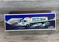 Side panel of box showing truck and race cars