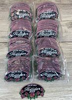 Eight plastic bundles of identical oval patches plus one loose for view