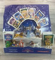 Front view of complete display with all figurines and VHS props visible