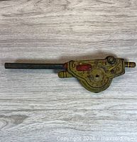 Full view of tin litho gun part showing body and barrel