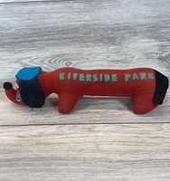 Left side view showing full plush, lettering, colors