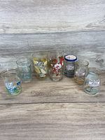 All six glasses lined up on wood surface