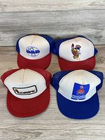 All four vintage mesh snapback hats front view