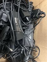 Top view of box filled with tangled Targus AC adapters