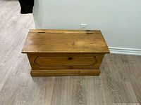 front view of wooden blanket chest closed
