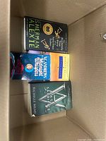 Top view showing Sherman Alexie, Richelle Mead and another paperback in box