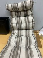 Full view of tufted chaise lounge cushion with headrest