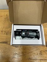 Camera in open box with packaging