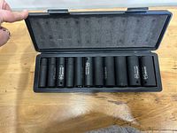 Open case showing all ten sockets in place