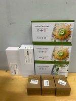 Overview showing three Premium Toner Cartridge boxes, two white boxes, three brown boxes