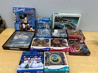 Group shot of all puzzle boxes on table