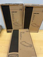 Three sealed Rubbermaid boxes showing Sturdy Chair tray graphic