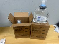 Two Purell 5395-02 cases, one opened showing cartridge, one sealed