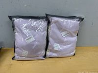 Two sealed duvet cover sets in clear zip bags