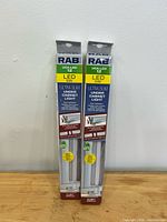 Front view of two sealed RAB UCA-LED 12 LED under-cabinet lights