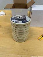 Stack of wool wheel discs standing upright