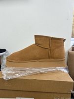 Side view left boot showing suede material and platform sole