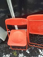 Two chairs, one open and one folded, showing design and materials