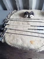 Six golf clubs with two headcovers overview