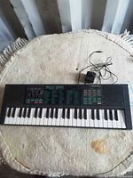 Full view of Yamaha PSS-270 keyboard and adapter