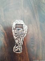 Front view showing chicken drumstick shape and embossed text