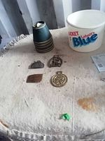 Overview of ice bucket, lamp shades, buckles, awards