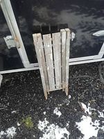 Platforms folded flat leaning against trailer