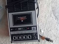 Front view of portable cassette recorder showing controls and auto-stop window