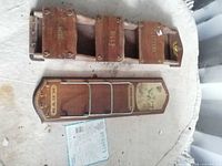 Front view showing both wooden wall holders, lettering and metal rails visible