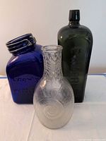 Group shot of three glass containers