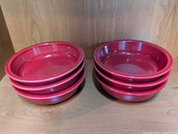 Two stacks of Fiesta Scarlet cereal bowls showing exterior and rim profile