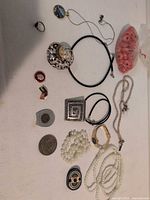 Group shot of all jewelry and tokens laid out