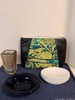 All four items: lucite cup, floral makeup bag, white soap dish, cobalt glass dish