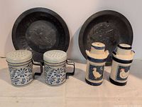 Full lot showing two pie tins and four shakers