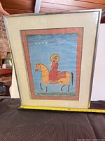 Front view of framed portrait print with measuring tape for scale