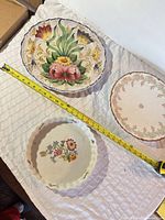 Top view showing all three plates with measuring tape indicating size