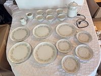 Full set layout showing coffee pot, creamer, sugar bowl, six cups, six saucers