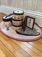 Bath mat, four storage boxes, framed print