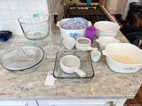 Overview of all bakeware and glassware on countertop
